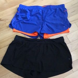 A bundle of 2 Danskin semi-fitted sports shorts.